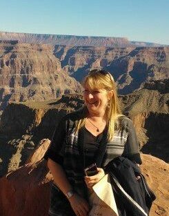 Tracey Itterly sits with mountains behind her in Las Vegas.