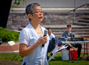 Michiko Okaya talks at an outdoor event