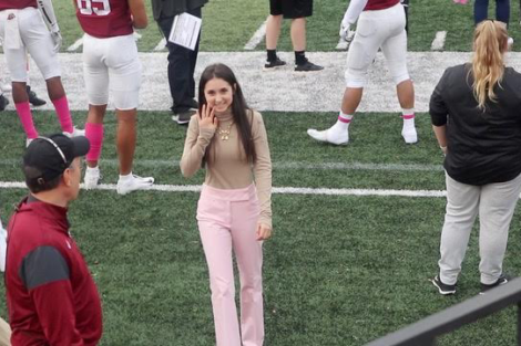 Danielle Kraidin on Lafayette's football field to sing the national anthem