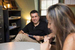 Joaquin Minambres meets with a student.