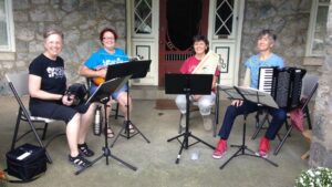 Becky Rosenbauer and three fellow musicians who played together for PorchFest