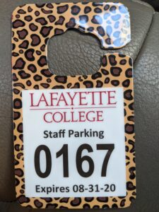 A leopard print employee parking hang tag