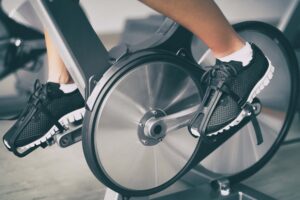 The wheels of an exercise bike in use