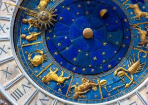 A clock with astrology symbols