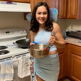 Kellie Kottmann holds a bowl in the kitchen and stirs.
