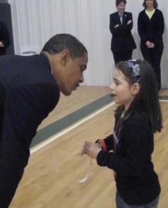 Eight-year-old Kaitlin Ahern speaks with then-Senator Barack Obama.