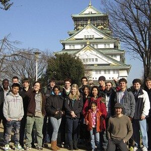 A group of Lafayette College students stands outside a building in Japan.
