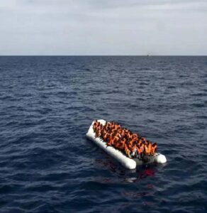 Migrants on a boat in the ocean