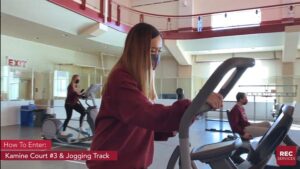 Several students use cardio machines at the fitness center.