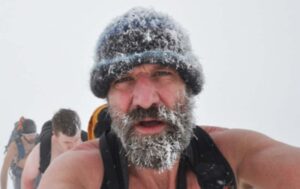 Wim Hof hikes with others in the snow