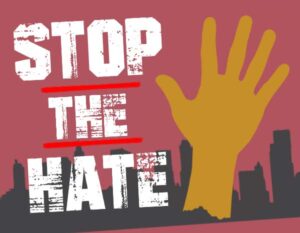 An illustration of a yellow hand against a black skyline and the words Stop the Hate