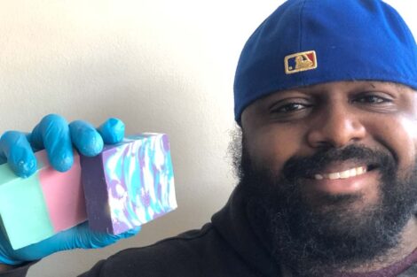 Terrence Haynes holds up a bar of soap that he made.