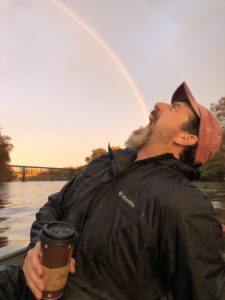 Crew club had coach Rick Kelliher opens his mouth in front of a rainbow so it looks like it's going into his mouth.