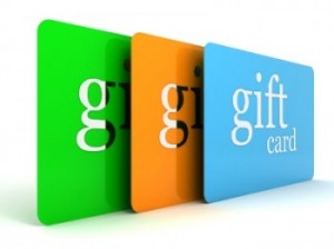 Three gift cards, one in green, one in orange, and one in light blue