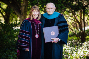 Lafayette President Alison Byerly with Dick McAteer as he holds his honorary degree from Lafayette College