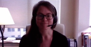 Annie- de Saussure wears a headset during a Zoom interview.