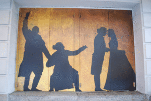 Silhouettes of four characters in the musical Hamilton