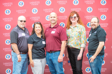 Five College Store employees pose in front of the Lafayette-branded backdrop at the conclusion of the faculty-staff awards event at Fisher Stadium
