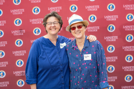 Mary Armstrong and Angelika Von Wahl pose in front of the Lafayette-branded backdrop at the conclusion of the faculty-staff awards event at Fisher Stadium