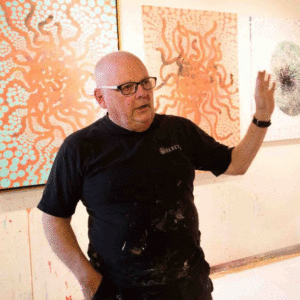 Ed Kerns teaches in front of absract paintings