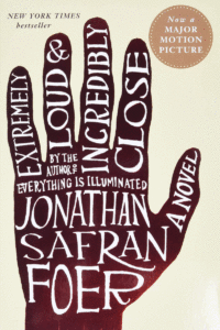 The cover of the book Extremely Loud and Incredibly Close, with a hand that has the title of the book and author's name on it