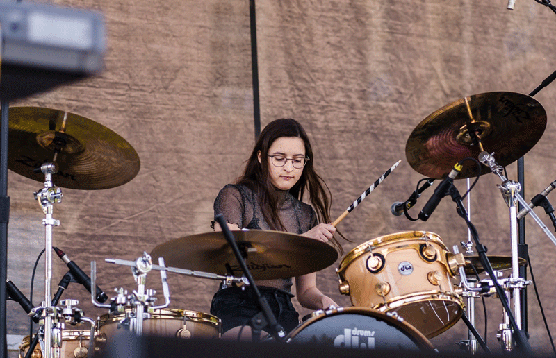 Jennifer Galdieri plays the drums on stage at Lafchella.