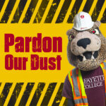 The Leopard mascot wearing a hardhat and construction vest alongside the words Pardon Our Dust