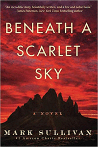 Cover of the book Beneath a Scarlet Sky, with mountains and a red sky and clouds above and behind