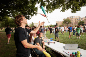 A student juggles pins during the Student Involvement Fair.