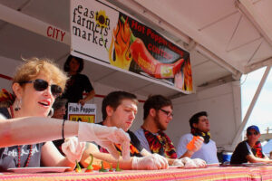 Five people at a table for a hot pepper eating contest