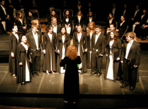 Professor Jennifer Kelly directs the Concert Choir and Chamber Singers on the Williams Center stage.