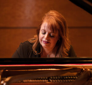 Holly Roadfeldt plays the piano.