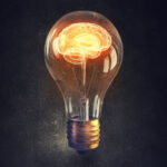 Illustration of a light bulb with a brain inside