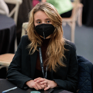 Lucie Lagodich wears a black health mask indoors at the United Nations Climate Change Conference i Glasgow, Scotland.