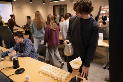 A student pours coffee for others to sample during Professor Joseph Woo’s FYS143 Coffee Showcase.
