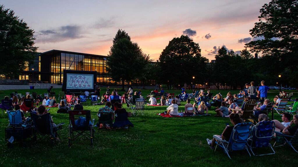 Campus and community members gather at sunset in July 2022 for Movies on the Quad.