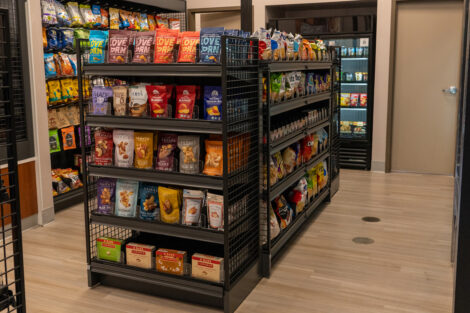 Shelves of packaged snacks are displayed at the new Simon's Market.