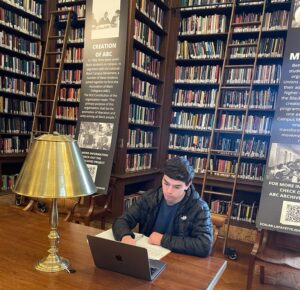 Matthew Reiss studies at a table at Kirby Library.