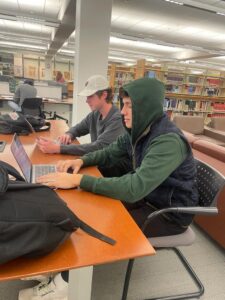 Two students study at the tables in Skillman