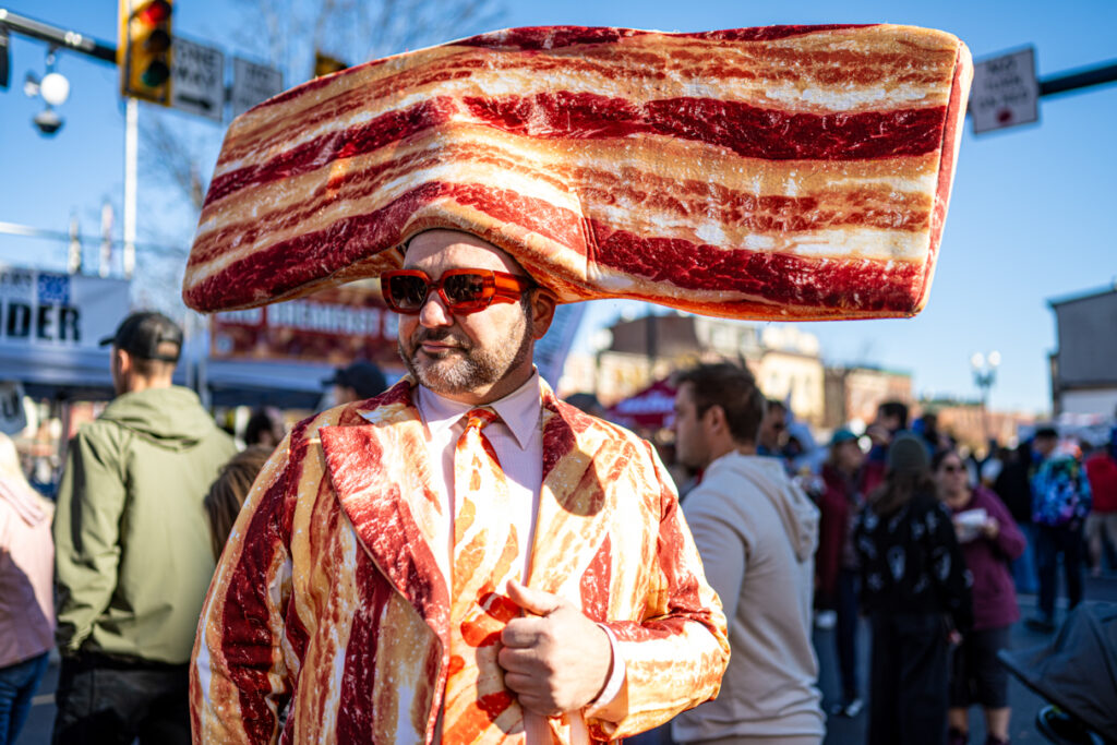 A person dressed in a bacon costume. 