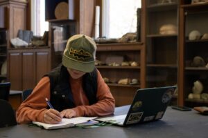 Ellie Spencer ‘26, Biology major, Geology minor, studies inside Van Wickle Hall ahead of finals.