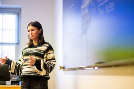 Megan Dursema, a former Girl Scout, explains a financial lesson to Girl Scouts.