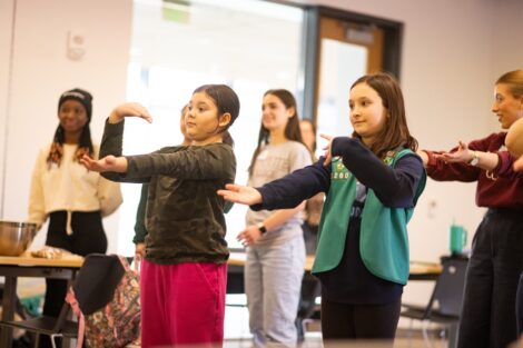 Girl Scouts learn about coding during a dance party at Girl Scout Badge Day.