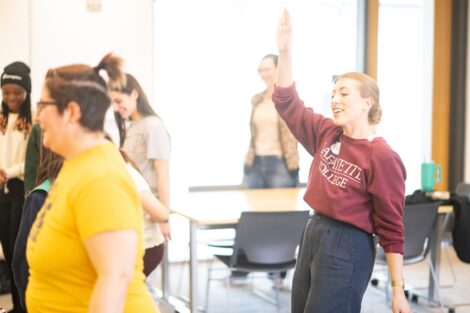 Prof. Lauren Biernacki dances along with Girl Scouts and leaders as she teaches a Coding Session during Girl Scout Badge Day.