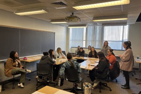 Michelle Pretopapa and Shelby Maguire share financial knowledge with Girl Scouts.