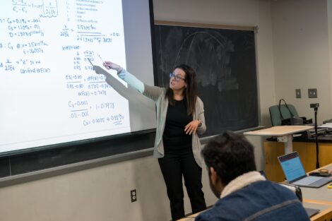 Melissa Gordon Associate Professor Chemical and Biomolecular Engineering, points to the board during class.