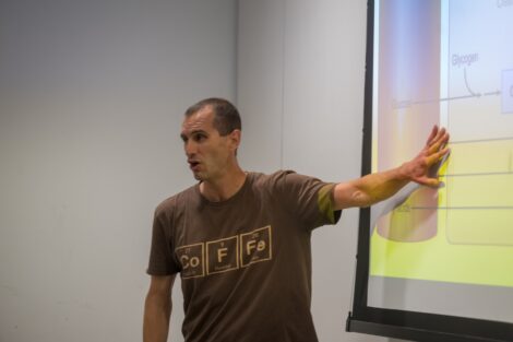 Mike Butler Professor and Department Head Biology points to a presentation.