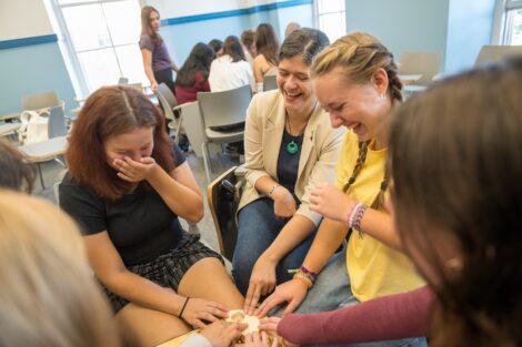 Ana Ramirez Luhrs Co-Dir of College Archives & Distinctive Collections laughs with a group of students