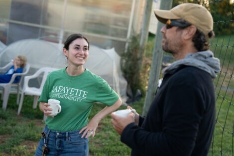 Samantha Comas, sustainability and outreach manager, is pictured talking with a guest at LaFarm.