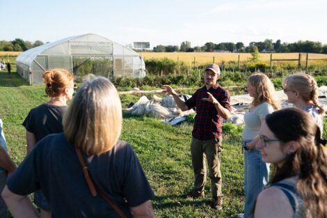 Josh Parr talks with a crowd gathered for a tour at LaFarm.